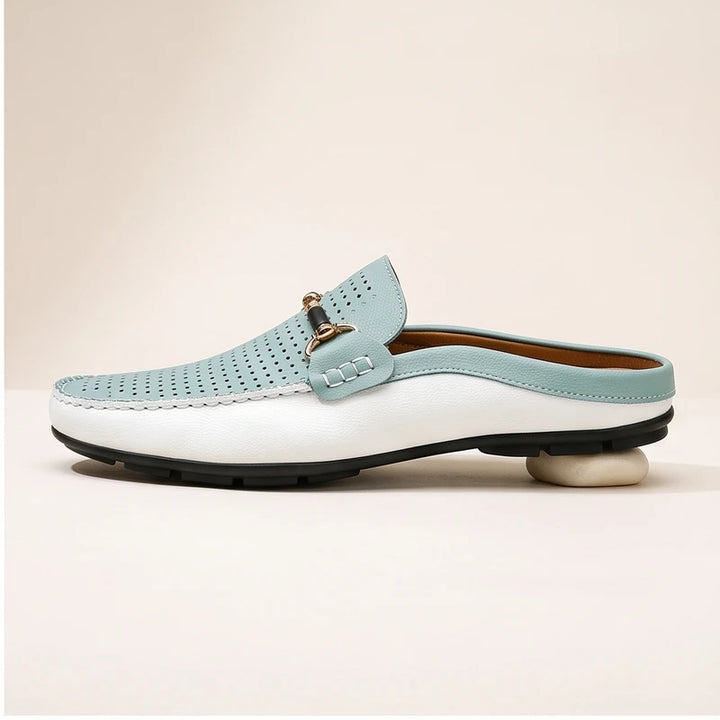 Blue leather loafers in a studio background - 2