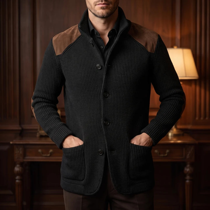 Black knit cardigan in a dark wood interior