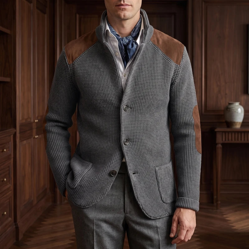 Gray knit cardigan in a dark wood interior