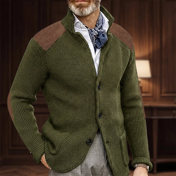 Green knit cardigan in a dark wood interior