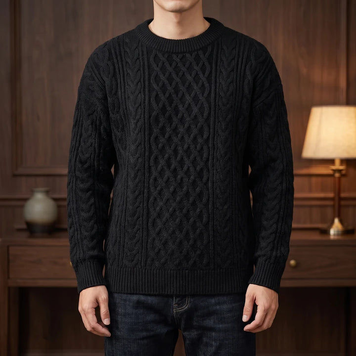 Black knitted sweater in a dark wood interior