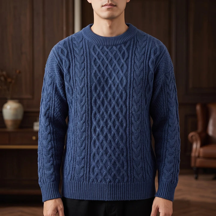 Blue knitted sweater in a dark wood interior