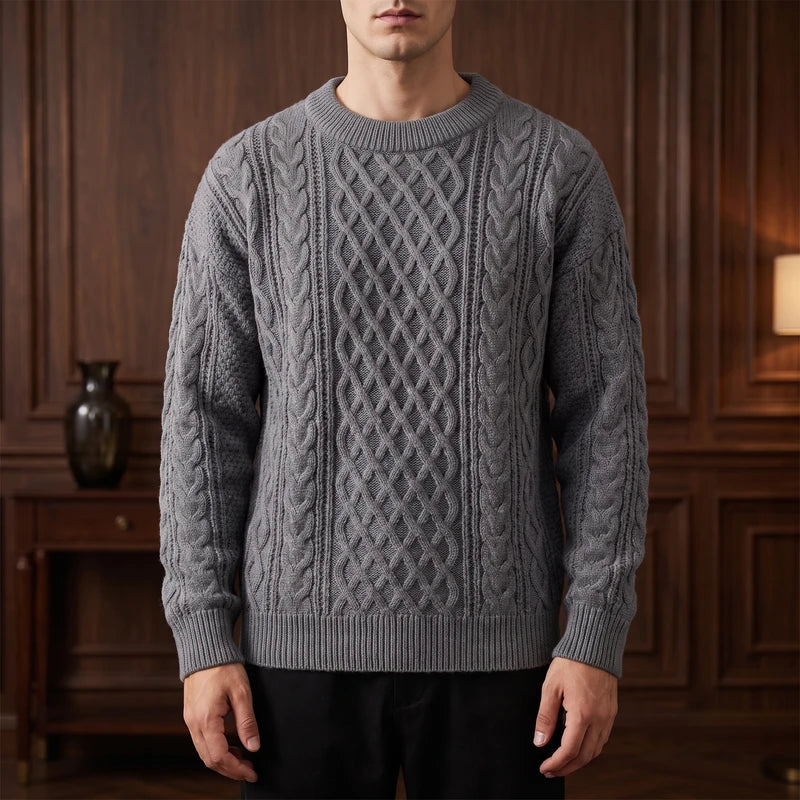 Gray knitted sweater in a dark wood interior