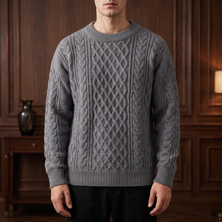 Gray knitted sweater in a dark wood interior
