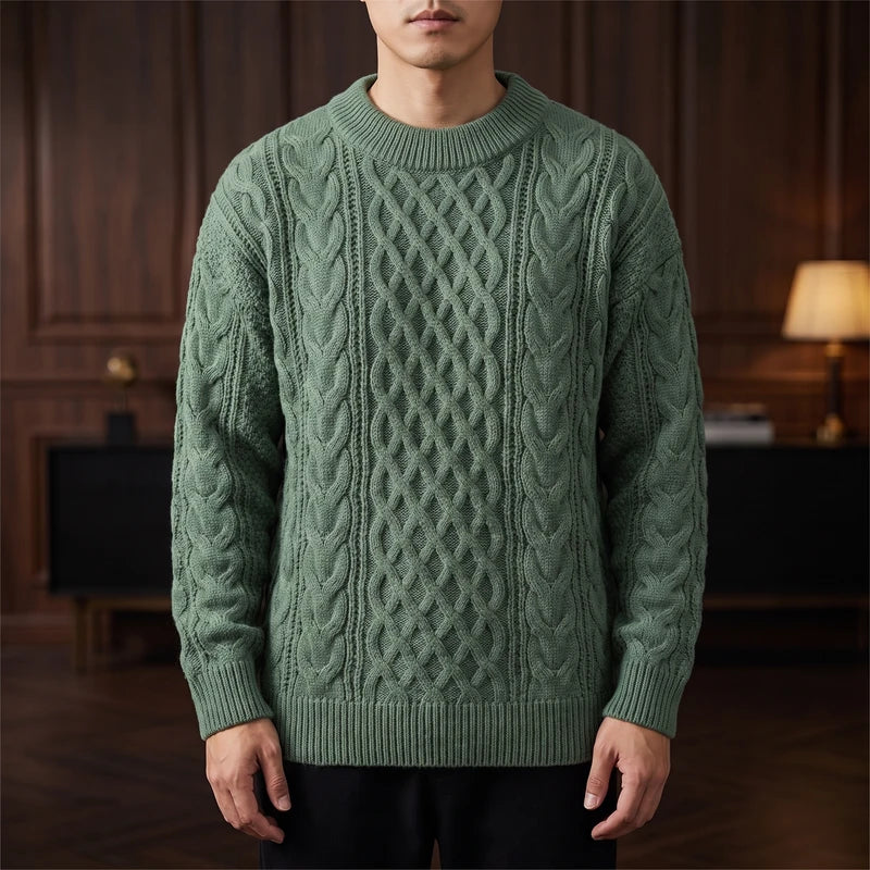 Green knitted sweater in a dark wood interior