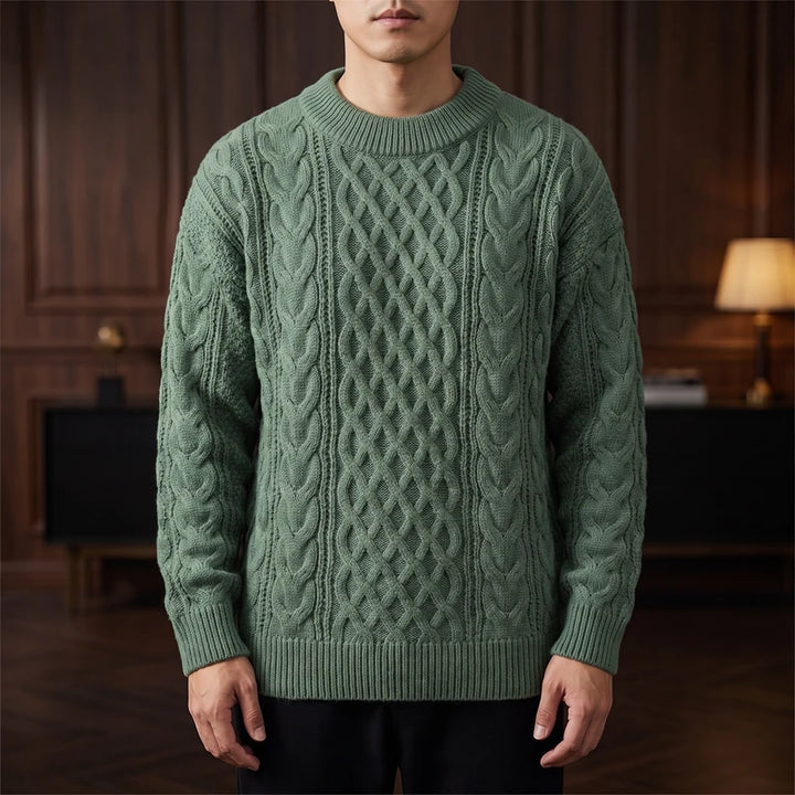 Green knitted sweater in a dark wood interior