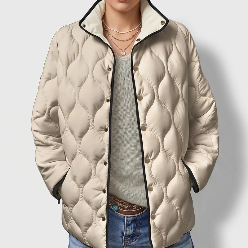 Beige cotton jackets on an off-gray studio background