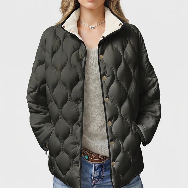 Black cotton jackets on an off-gray studio background