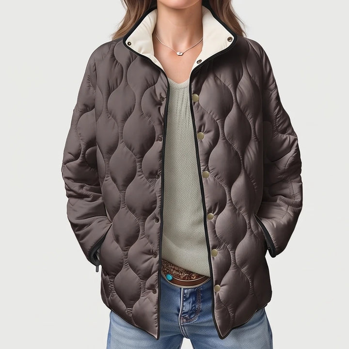 Gray cotton jackets on an off-gray studio background