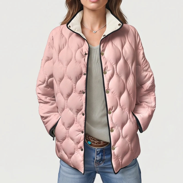 Pink cotton jackets on an off-gray studio background