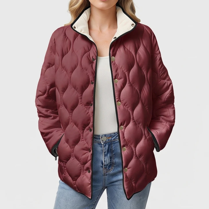 Red cotton jackets on an off-gray studio background