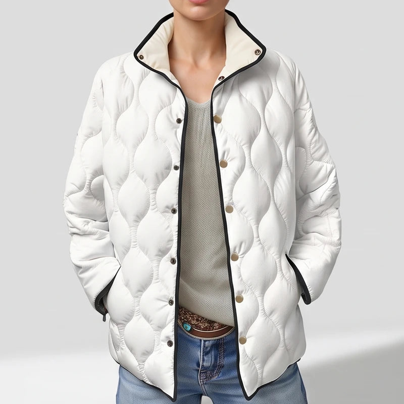 White cotton jackets on an off-gray studio background