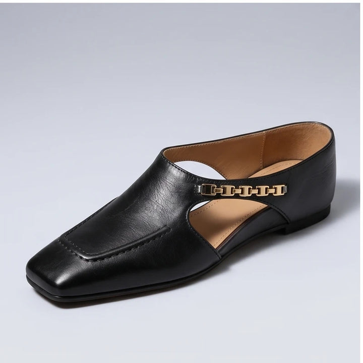 Black genuine leather square-toe mules with gold chain detail.