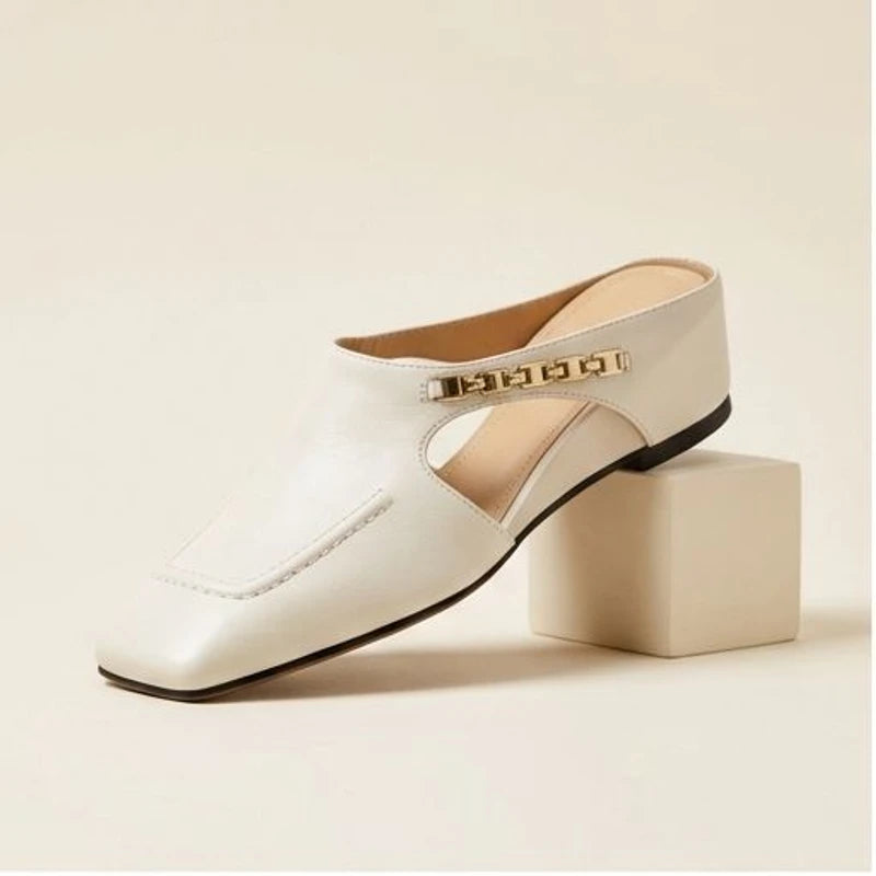 White genuine leather square-toe mules with gold chain detail.