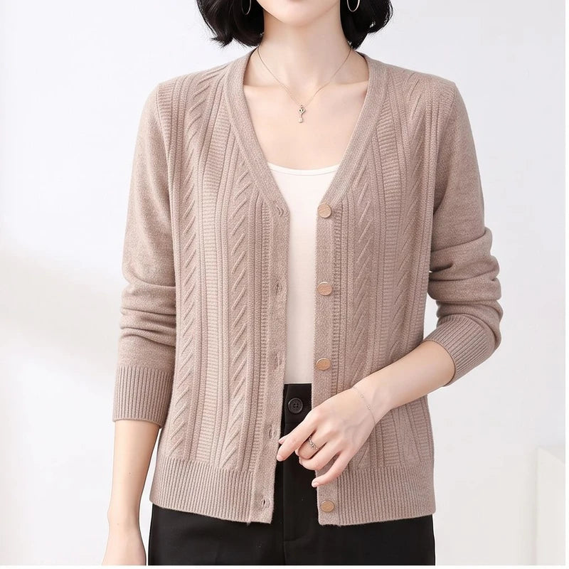Model wearing Camel knitted cardigan in a studio