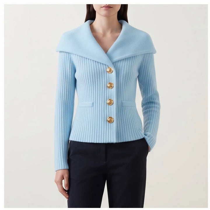 Model wearing blue knitted jacket in a studio