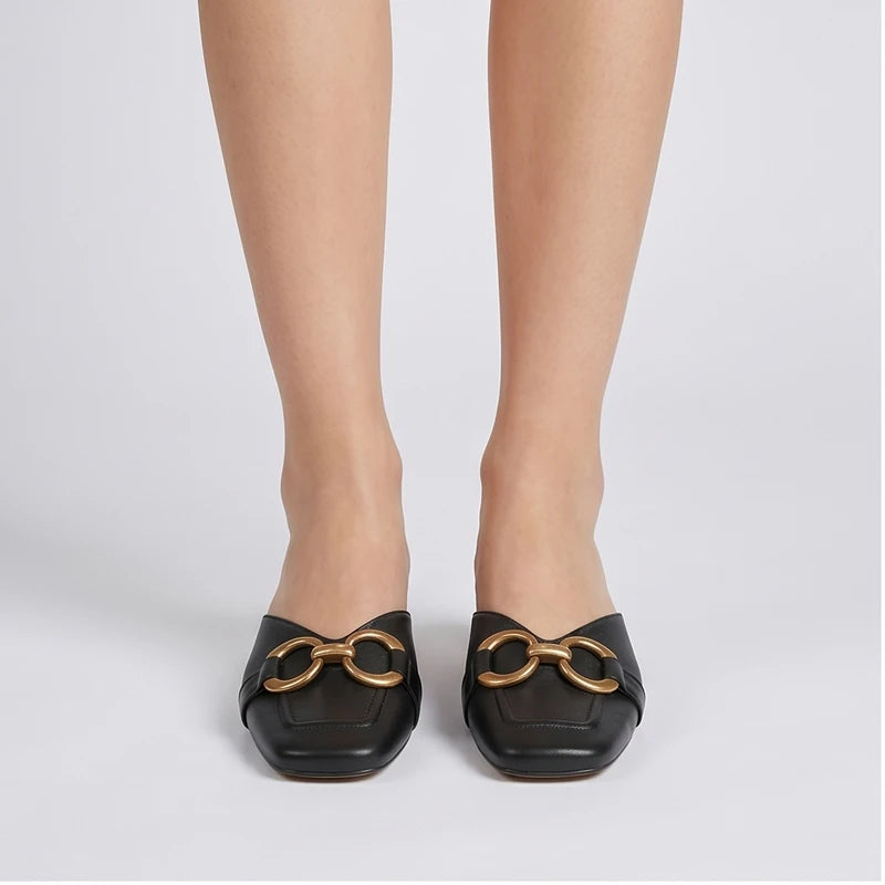 Model wearing Black Quincy Genuine Leather Square Toe Mules in studio