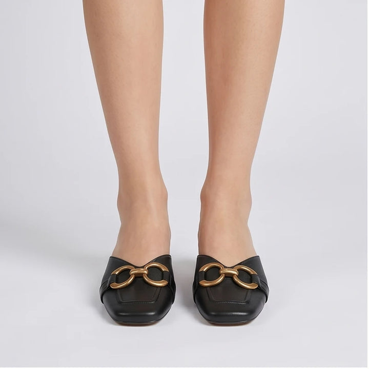 Model wearing Black Quincy Genuine Leather Square Toe Mules in studio