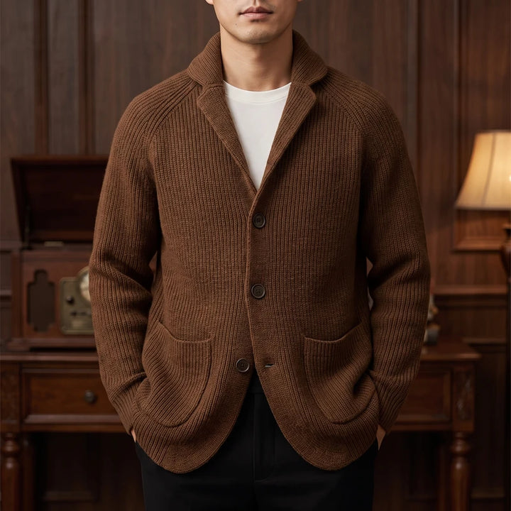 Brown knit cardigan in a dark wood interior