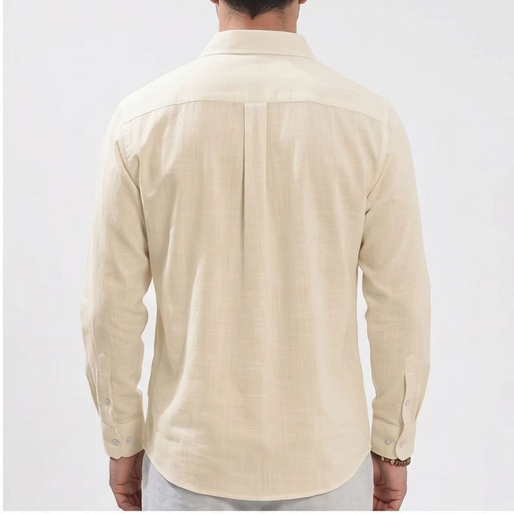 Men's beige linen button-up shirt with pleats on the back.