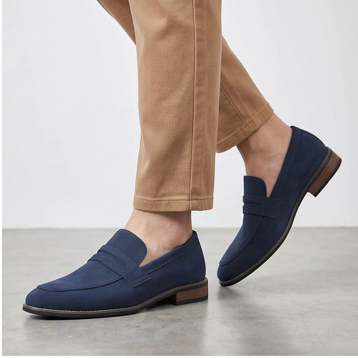 Model wearing Blue suede loafers in a studio - 2