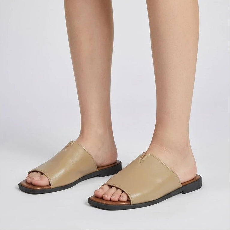 Model wearing Khaki Shiny Metallic Flat Slides for Women Square Toe Open Toe Lightweight Comfortable Summer Beach Casual Daily Walking Shoes in studio