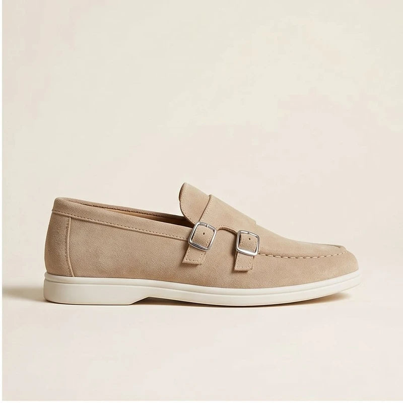 Tan suede double monk strap loafers with silver buckles.