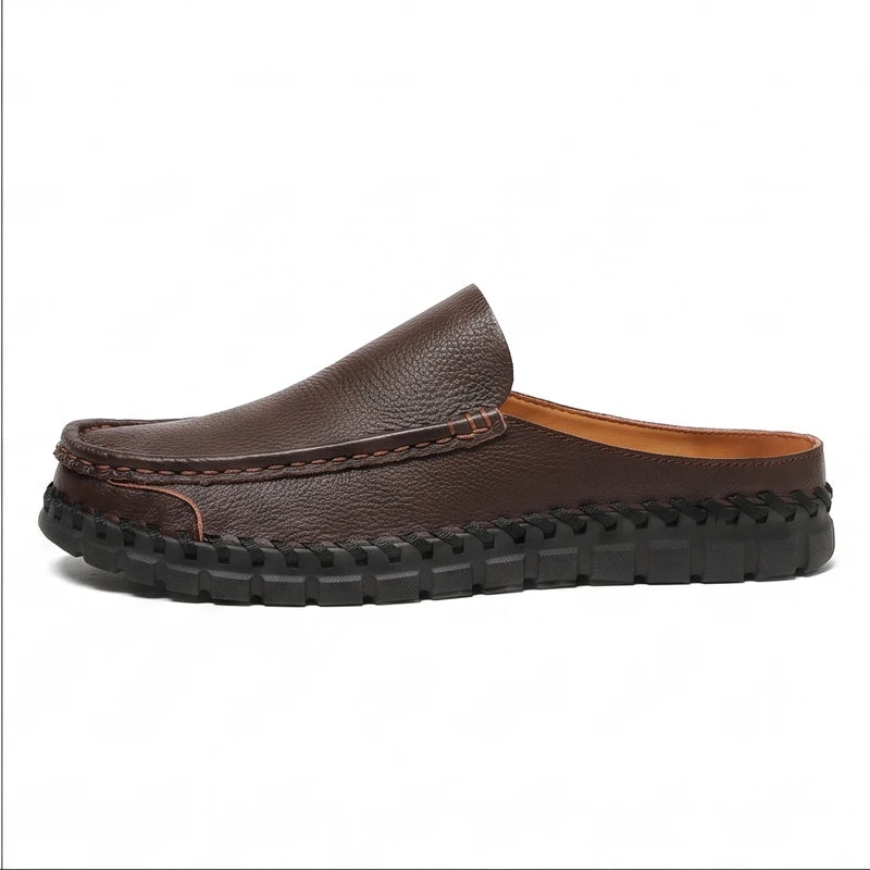 Brown leather mule on a white background