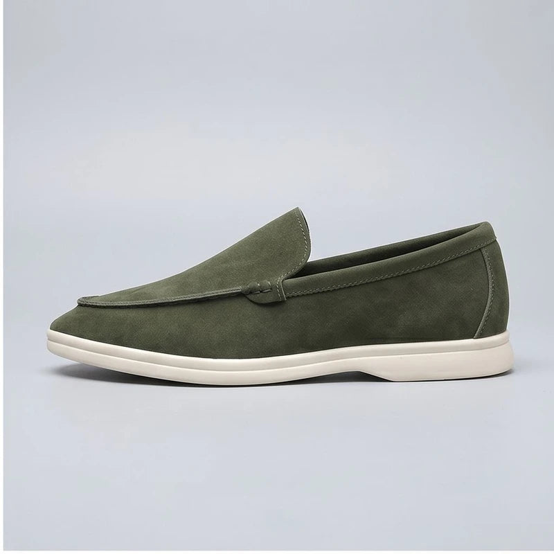 green suede loafers in a studio background - 2