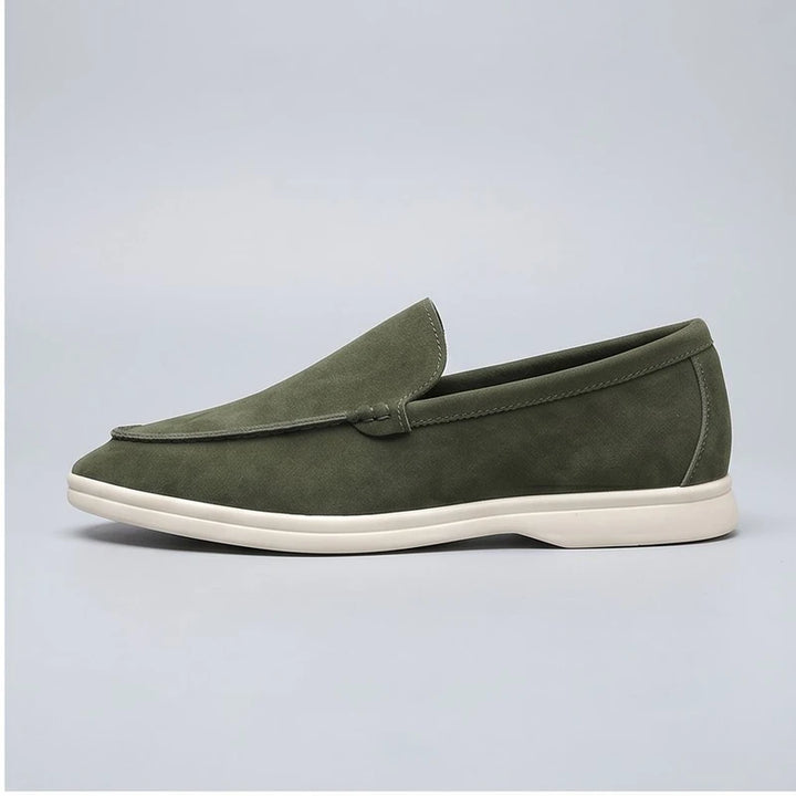 green suede loafers in a studio background - 2