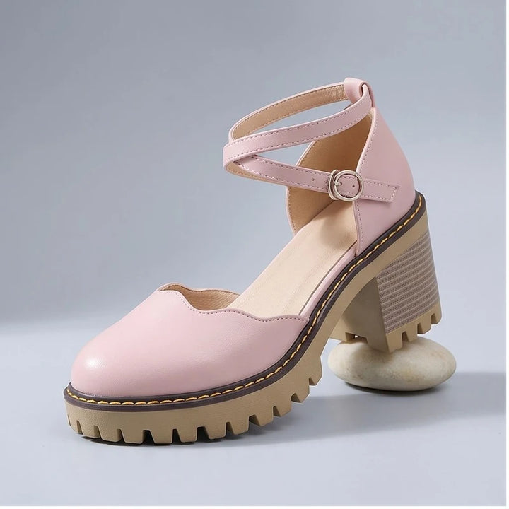 Pink heels in a studio background