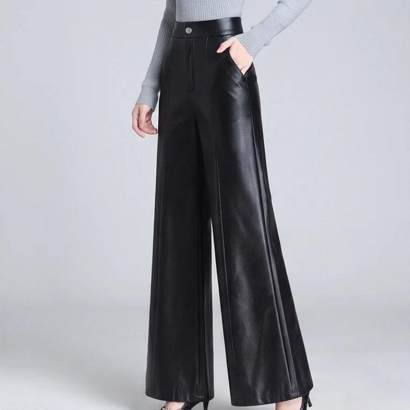 Black leather pants on an off-gray studio background - 2