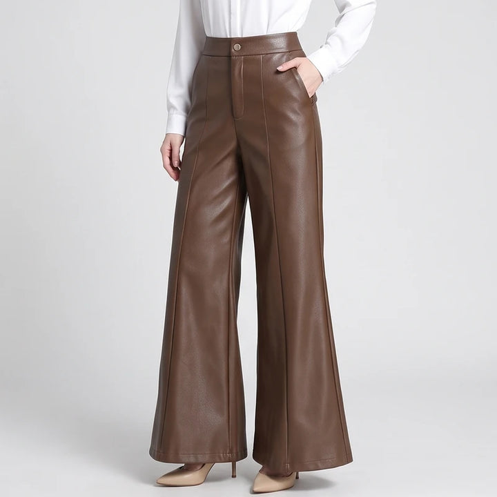 Coffee leather pants on an off-gray studio background