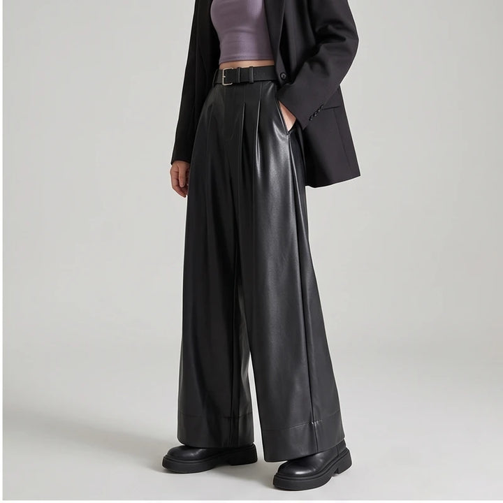 Black leather pants on an off-gray studio background - 2