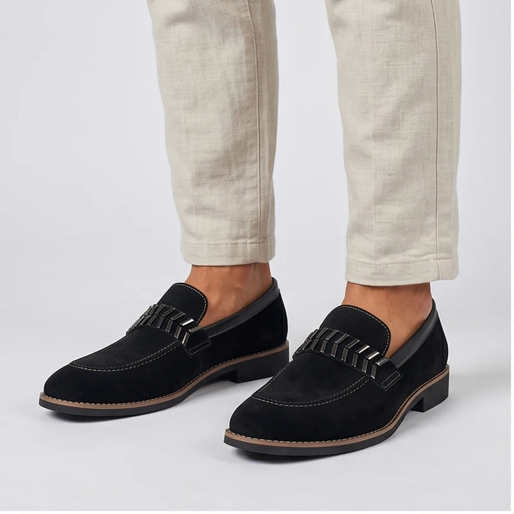 Model wearing Black Driscoll Suede Penny Loafers [needs new images[ in studio
