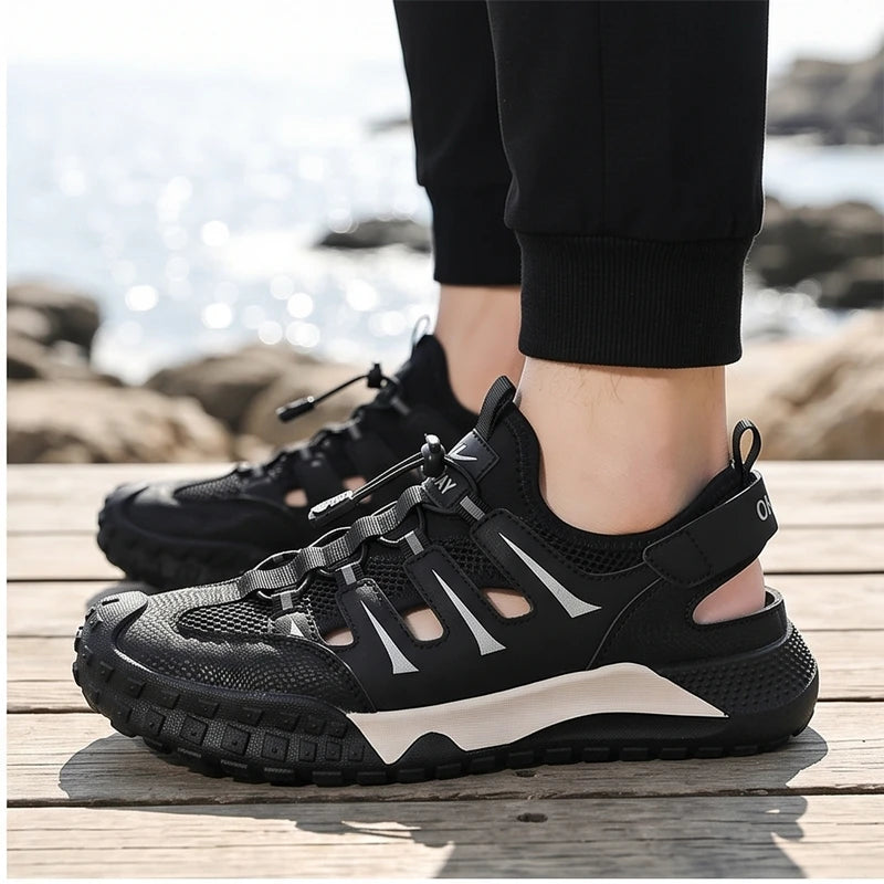 Model wearing Black 2026Men Beach Breathable Sandals Designer Brand Mesh Hollow-out Casual Shoes Outdoor Lightweight Non Slip Reman Sneakers for Men outdoors - 2