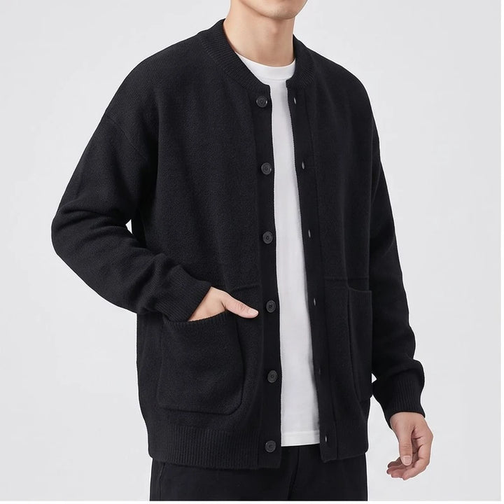 Model wearing Black knitted cardigan in a studio