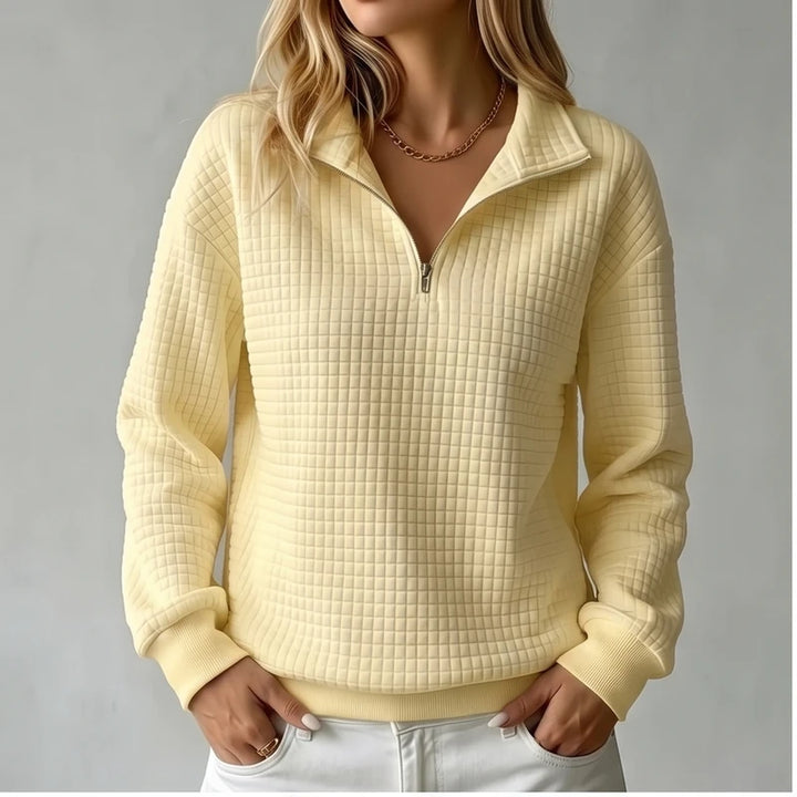 Model wearing Yellow knit pullover in a studio
