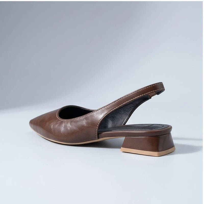 Brown leather flats in a studio background - 2
