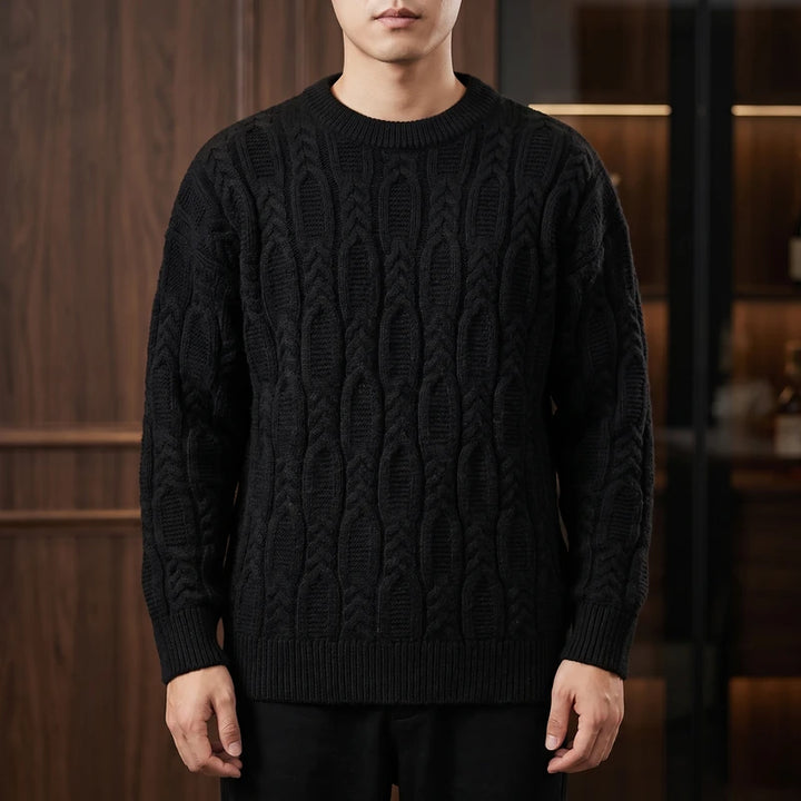Black knit pullover in a dark wood interior