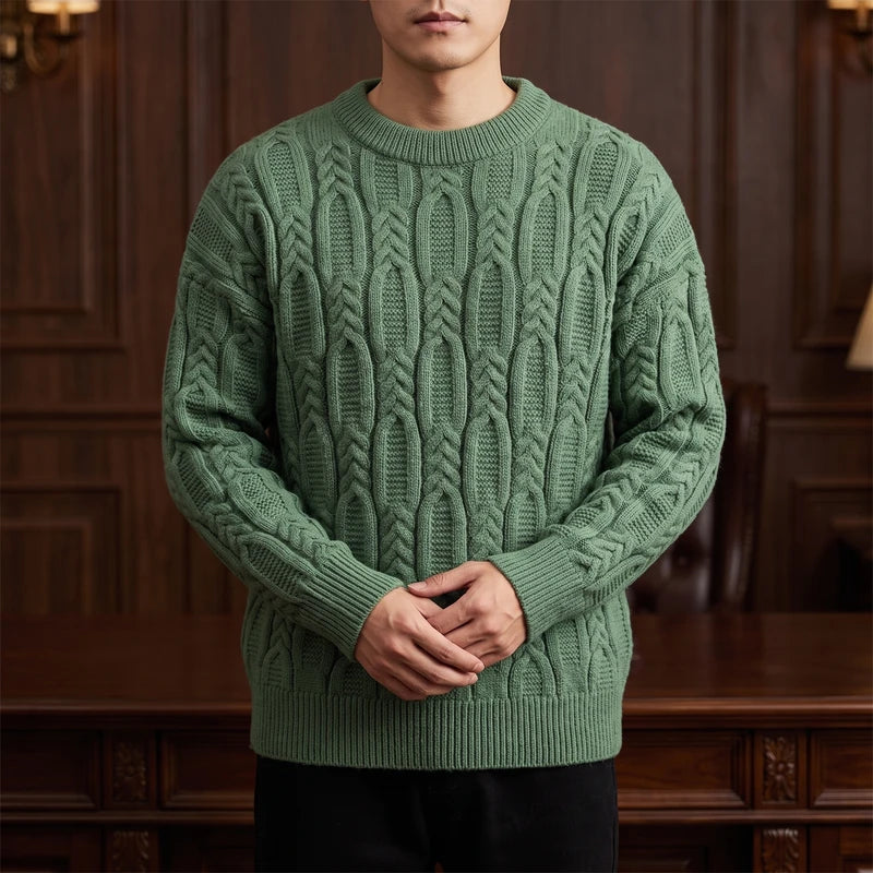 Green knit pullover in a dark wood interior