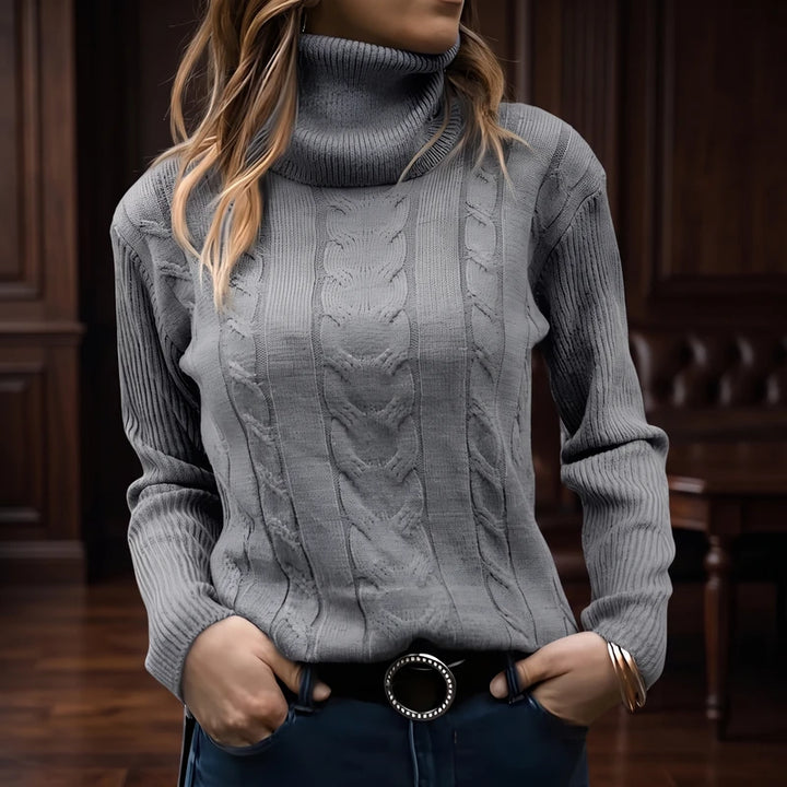 Gray knit sweater in a dark wood interior