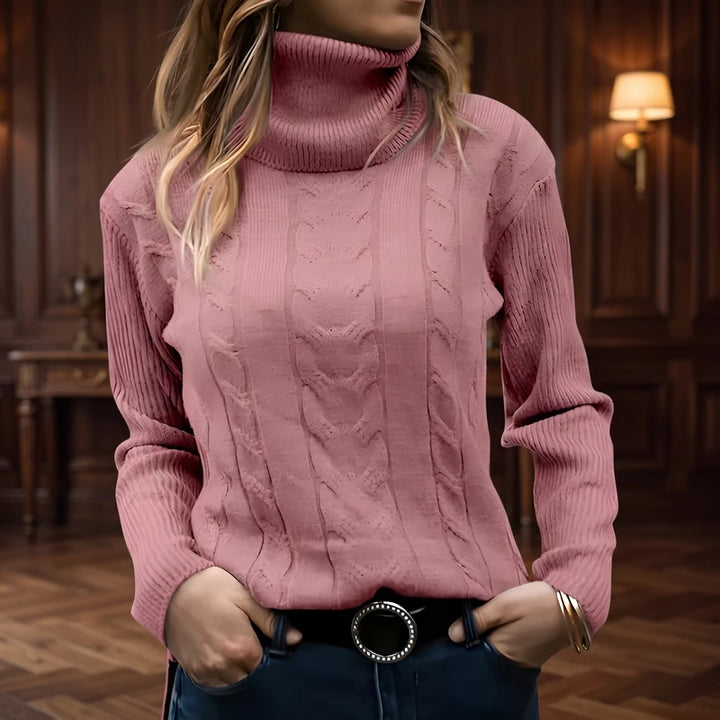 Pink knit sweater in a dark wood interior