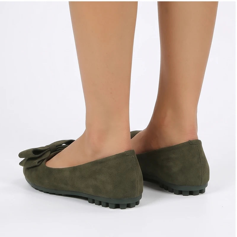 Model wearing Green Briony Suede Bow Flats in studio - 3