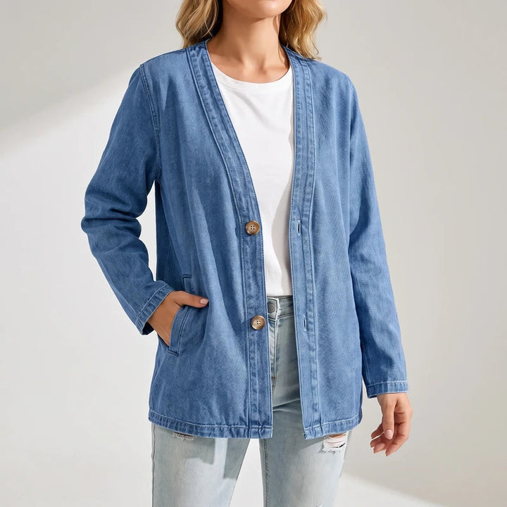 Blue cardigan on an off-gray studio background