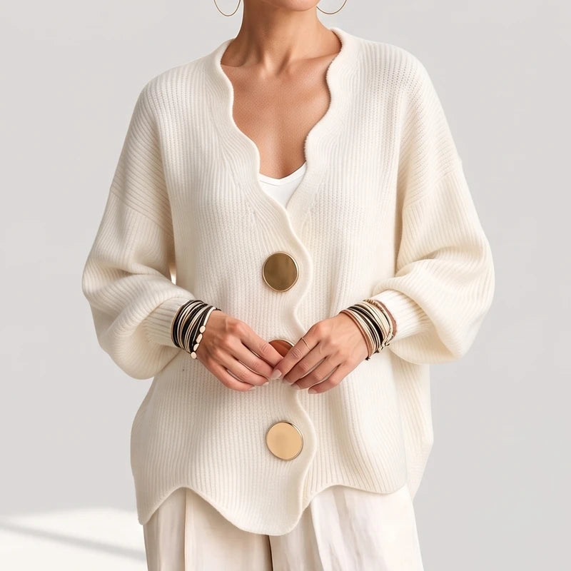 creamy-white knit sweater on an off-gray studio background - 2