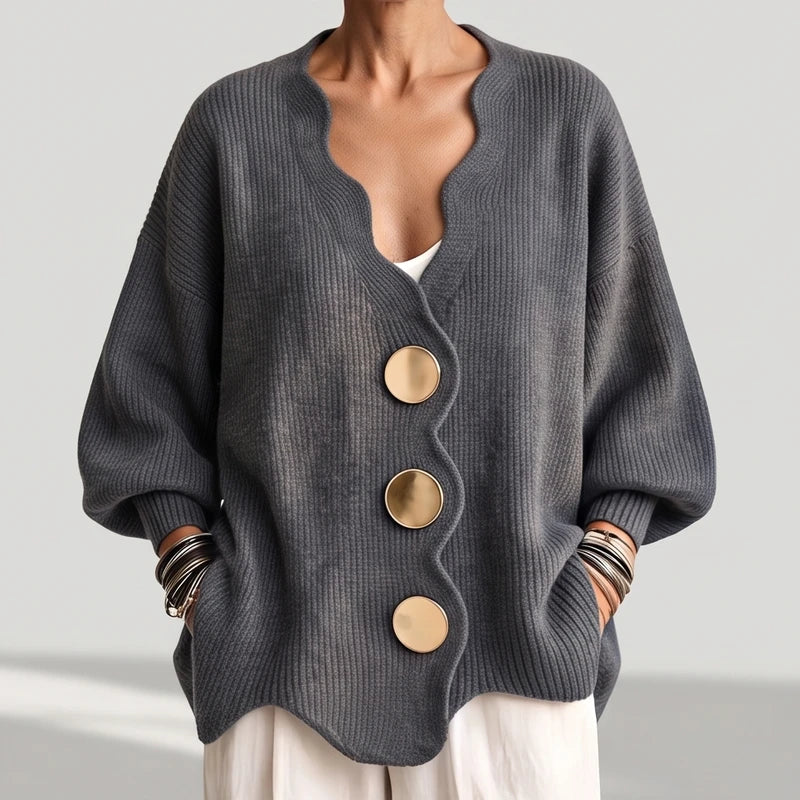 Dark Grey knit sweater on an off-gray studio background