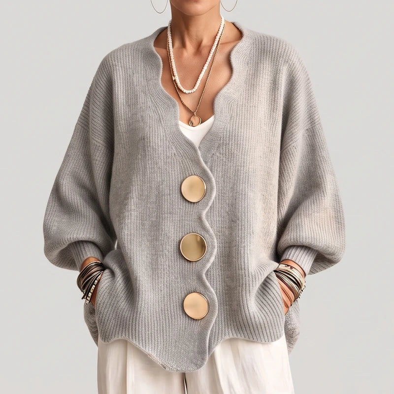 Light Grey knit sweater on an off-gray studio background