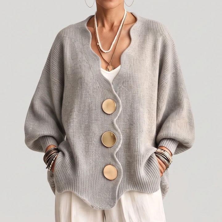 Light Grey knit sweater on an off-gray studio background