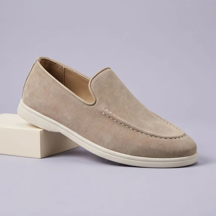 Beige suede loafers in a studio background - 2